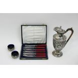 A silver plated coffee pot, pair of white metal salts and cased butter knives
