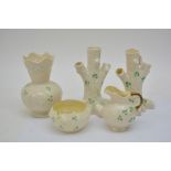 A collection of Shamrock decorated Belleek porcelain including spill vases