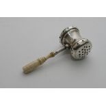 A Novelty silver child's rattle in the form of a gavel, with a turned bone handle. Makers initials