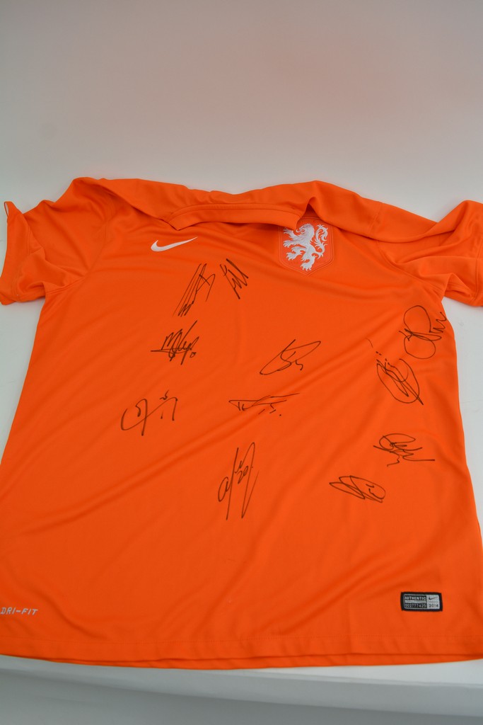 A Holland football shirt signed by 11 players from