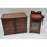 A smokers' cabinet with some pipes and an apprenti