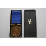 German WW2, SS LS and GC eight year medal, in corr