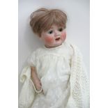 A German bisque headed doll marked CP.