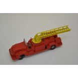 A boxed "Toby " clockwork coupe car, an unboxed Marx fire engine, an unboxed " Picsan " foden pipe