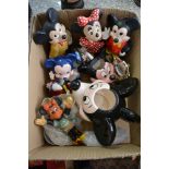 A box containing a collection of ceramic Mickey an