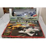 A boxed Scalextric Grand Prix racing set together with a box of track / barriers etc and a boxed