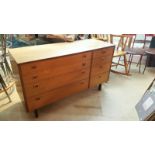 Alfred Cox chest of drawers. Each drawer of slim proportions. Bears makers details