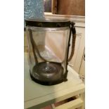 *Large glass hurricane lantern with distressed metal banding and rope handle, approx 27cm high, 20.