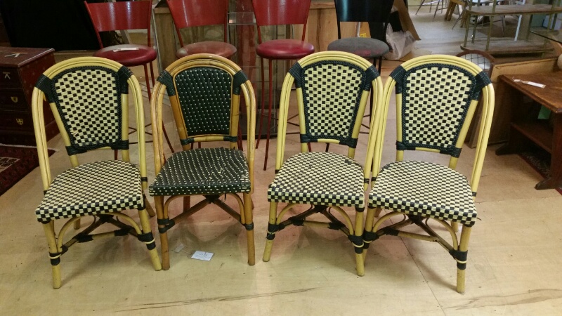 Four outdoor rattan style chairs in green and cream