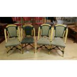 Four outdoor rattan style chairs in green and cream