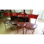 *4 red metal diner chairs, one with a cut-out back