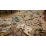 Collection of 12 large hessian sacks with various printed wording, the genuine thing as dried