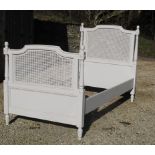 Single white painted french bed in white. Canework to headboard and footboard.