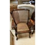 19th Century elbow chair. Caned seat and back (in good order). Queen Anne legs to pad feet