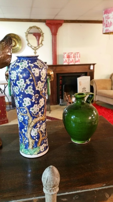 Two pottery vases, one a green studio flagon, glazed, the other a chinese style vase with link