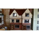 Large dolls house, in tudor style. This one is in three sections (per floor) so easy to transport.