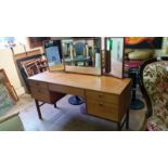 Alfred Cox dressing table. Central invisible drawer with additional drawers to sides.