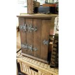 Free standing oriental wooden cabinet together with a further earlier