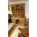 Pine dresser with glazed doors, good condition, brass drawer pulls. 137 cm wide, 40 cm deep, 198