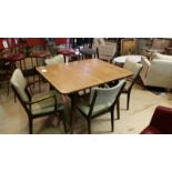 Mid-century extending dining table, together with 4 dining chairs with arms