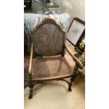 Bergere chair. Pavilion shaped high back, elaborate cross stretchers. Some restoration required to