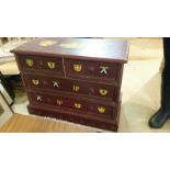 Substantial solid teak chest of 2 short and 2 long drawers. Hand painted and decorated with