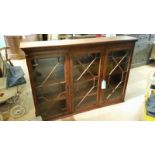 Glazed mahogany bookcase, key present, lovely condition. 144 cm long, 100cm high, 29cm deep.