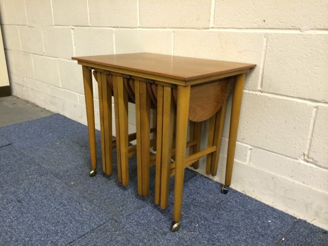 Very nice mid 20th century teak retro tables set..with 4 small circular tables stored under the main - Image 4 of 11