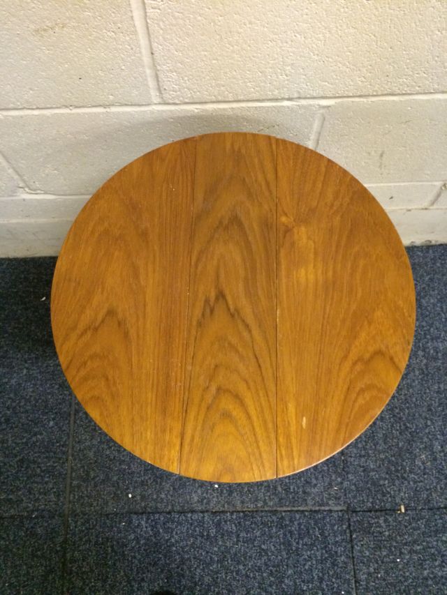 Very nice mid 20th century teak retro tables set..with 4 small circular tables stored under the main - Image 8 of 11