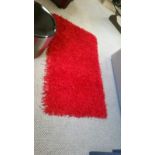 Red tassle rug