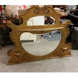 Large and very decorative overmantle mirror with gilded wood frame, lattice embellishment.