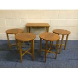 Very nice mid 20th century teak retro tables set..with 4 small circular tables stored under the main