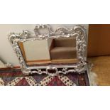 Large old silver-painted gilt mirror, frame measures 84 x 75 cm approx at widest points,