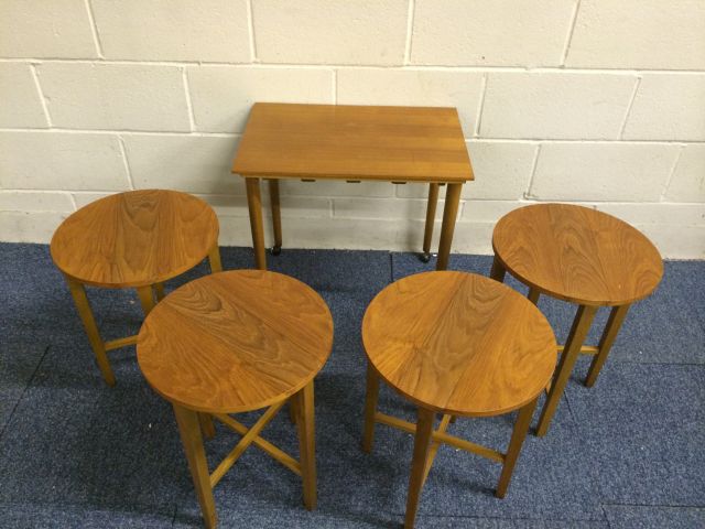 Very nice mid 20th century teak retro tables set..with 4 small circular tables stored under the main - Image 2 of 11