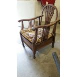 Delightful early 20thC armchair with fold-forward back, pierced splats. W: 56cm D: 65cm H: 84cm