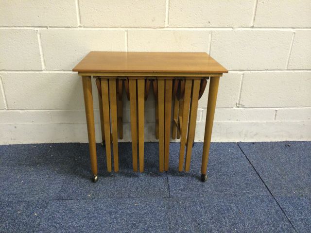 Very nice mid 20th century teak retro tables set..with 4 small circular tables stored under the main - Image 11 of 11