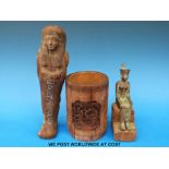 An Egyptian bronze seated figure of the god Neith on wooden plinth together with a carved wooden