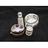 An enamelled brass mounted hinged trinket dish, silver mounted bottles and an unmarked example.