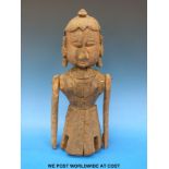 An Indian Rajasthan carved wooden figure with articulated limbs (38cm tall)