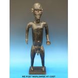 An African tribal figure (56cm tall)