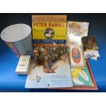 A collection of Peter Rabbit ephemera including a jigsaw, resin model of Benjamin Bunny,