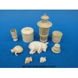 A quantity of ivory items to include fine pierced screw top pot,