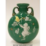 A 19thC Bohemian glass moon flask with enamelled decoration of a putti with playing card and a