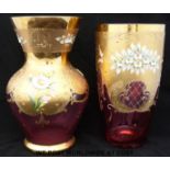 Two gilt and enamelled cranberry glass vases with applied flower decoration,