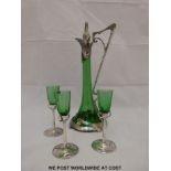 WITHDRAWN   An Art Nouveau white metal and glass ewer and three liquer glasses,