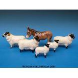 A small flock of Beswick sheep - a ram,