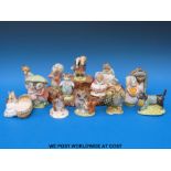 Fourteen Royal Albert Beatrix Potter figures and a Beswick ceramic base