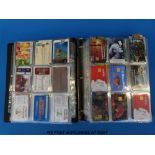 A large album of all world telephone cards including sport, glamour, film, wildlife etc.