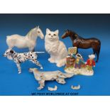 A collection of Beswick and other figures to include a dalmatian, a cat, two horses,