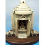 A finely carved Chinese ivory shrine, the interior with a figure of Guanyin,